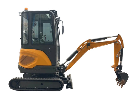 Small excavator on a concrete surface with a building in the background