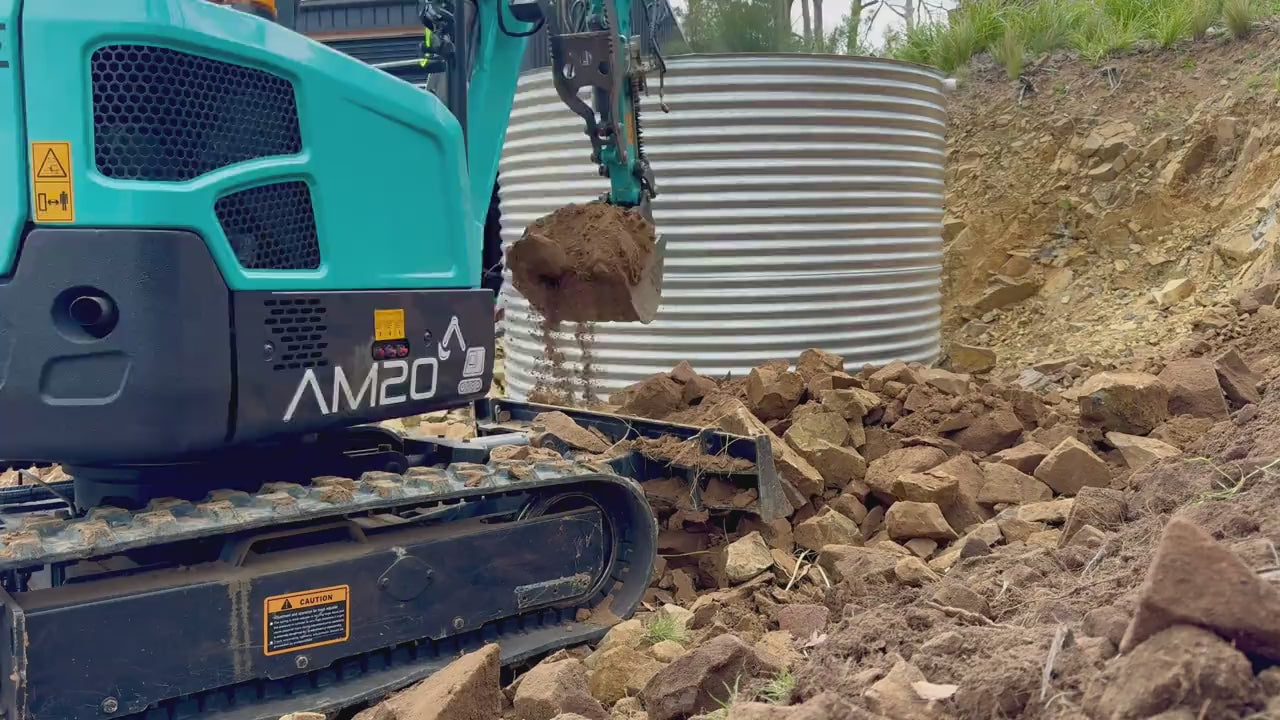 Load video: An AM20 Mini Excavator in use, with review discussion with professional operator.
